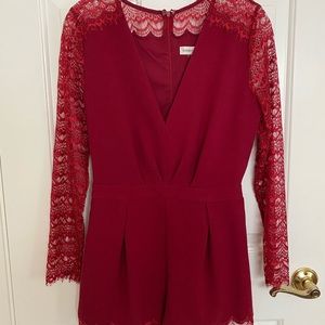 RED ROMPER - Laced long sleeve.Used once.Fits S-M.
